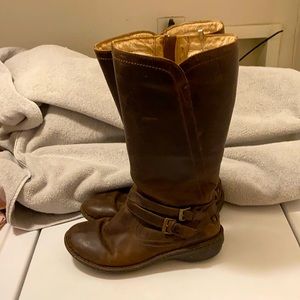 Ugg brown leather boots with strap.